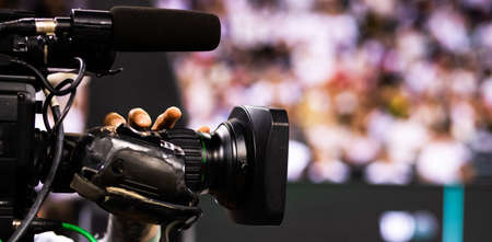 cameraman filming an event focus on cameraの写真素材