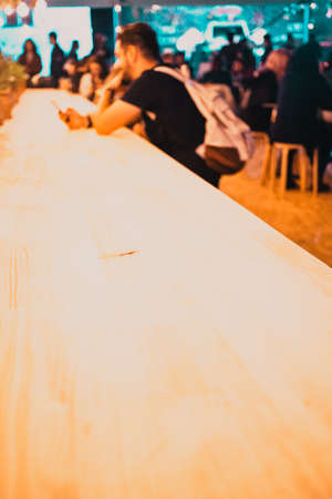 people sitting at a bar - focus on tableの写真素材