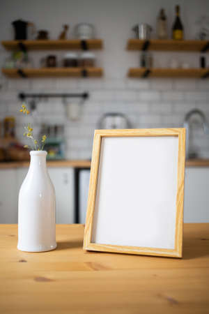 empty frame on modern kitchen table mock up space for your textの写真素材
