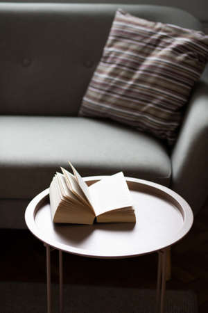 open book on a living room tableの写真素材