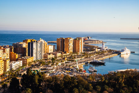 view over Malaga at sunset travel bannerの写真素材