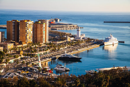 view over Malaga at sunset travel bannerの写真素材
