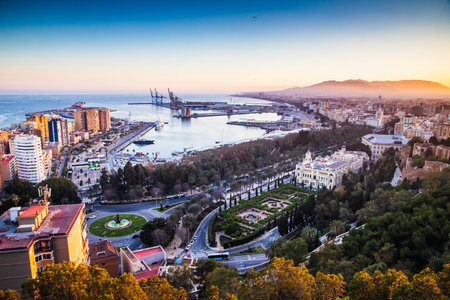 view over Malaga at sunset travel bannerの写真素材