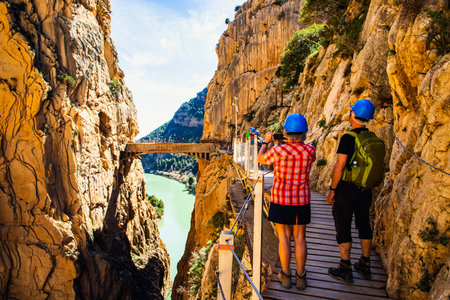 elderly couple trekking in Caminito Del Rey Trail in Andalusiaの写真素材