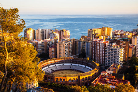 view over Malaga at sunset travel bannerの写真素材