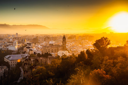 view over Malaga at sunset travel bannerの写真素材