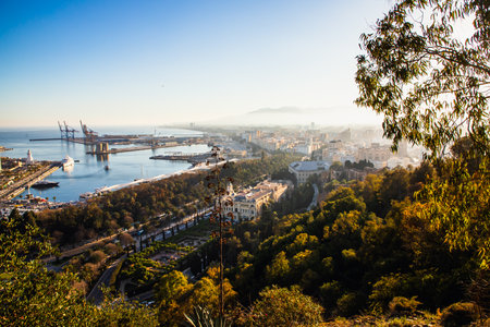 view over Malaga at sunset travel bannerの写真素材