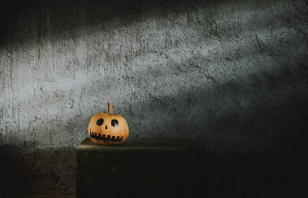 scary funny Halloween pumpkins on wooden tableの写真素材