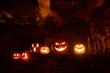scary Halloween background with Jack'o'lanterns and skeletonの写真素材