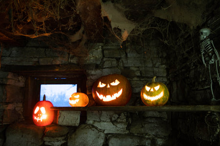 scary Halloween background with Jack'o'lanterns and skeletonの写真素材