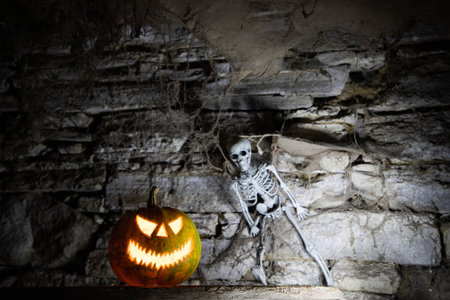 scary Halloween background with Jack'o'lanterns and skeletonの写真素材