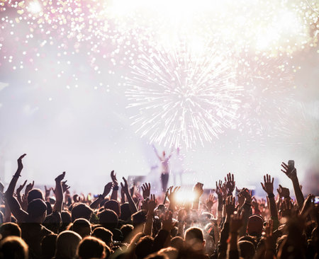 fireworks display and crowd celebrating happy new yearの写真素材