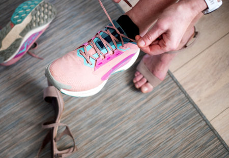 woman changing high heels to running shoes active lifestyle