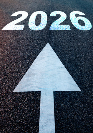 white arrow and 2026 written on concreteの写真素材