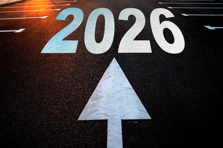 white arrow and 2026 written on concreteの写真素材