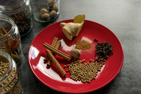 The concept of home-made mulled wine. Set of spices: cinnamon, nutmeg, cloves, ginger.