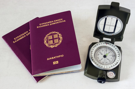 Two passports and a compass. Concept - preparation for travel, vacation.の写真素材