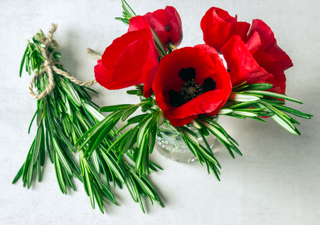 Bouquet of red poppies and rosemary. Spring. Sunny day. Greece.の写真素材