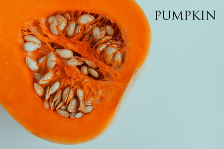  Pumpkin halved on white background with copy space. Butternut squash. Concept - organic food, vegetarianism, healthy food. Text.の写真素材
