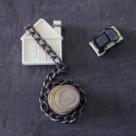 House in chains. Concept  -  risks, lose property,  seize, mortgage.の写真素材