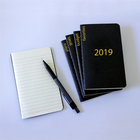 5 black notebooks, which will be recorded plans, favorites, goals,  budget, achievements in the coming new 2019 year. Planning concept, New year, Christmas, wishes and dreams.の写真素材