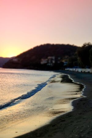Sea at sunset. Summer evening on an island in Greece. Selective focus.の写真素材