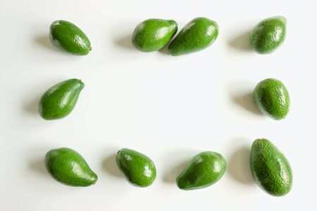 Ripe avocado fruits on a white background. Concept of healthy eating, vegetarianism.