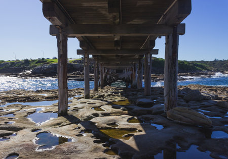 Bottom of a wooden bridge in Sydney, Australiaの写真素材