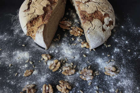 Sourdough bread with pinches of flour on the ground.