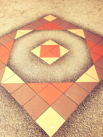 Square and triangular tiles on the floorの素材