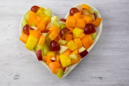 Fresh fruit salad with pineapple, grapes, red apples, canteloupe and honeydew melons.