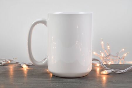 15 oz Coffee Cup Mockup with Glowing White Lightsの写真素材