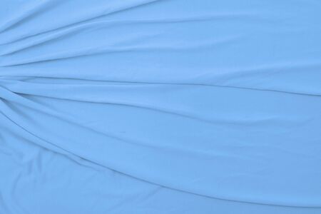 Top down view of flowing baby blue fabric.の写真素材