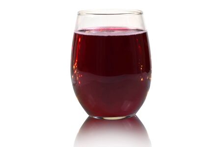 No stem wine glass filled with red wine on a white background.の写真素材