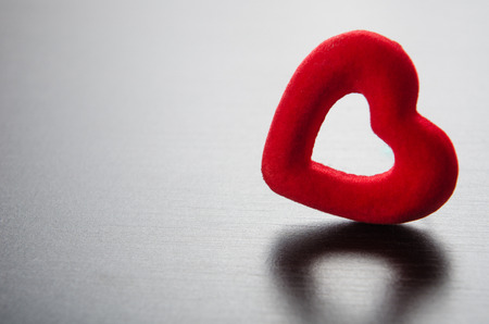 red velvet heart on a wooden backgroundの写真素材