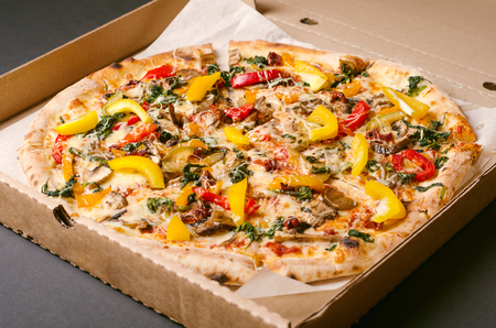 Vegetarian pizza with vegetables in cardboard box. Deliveryの写真素材