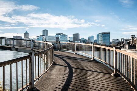 Portland, Oregon - December 08, 2017: Spiral pedestrian bridge overlooking the Willamette River and the downtown city skyline.のeditorial素材