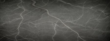 Elegant marbled black empty horizontal background. Luxury antique card. Old blurred texture wallpaper. Background blackboard website. Vintage textured web banner header board. Copy spaceの写真素材