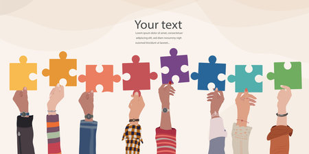 Problem solving concept. Raised hand up of multicultural business women and business men holding a jigsaw puzzle piece. Metaphor. Strategy concept. Joining puzzle pieces. Matchのイラスト素材