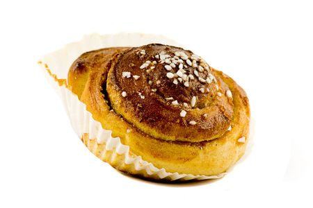 A nice homemade cinnamon roll isolated on whiteの写真素材
