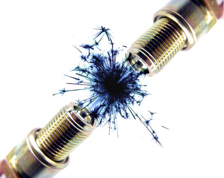 Two Spark plugs together and making sparksの写真素材