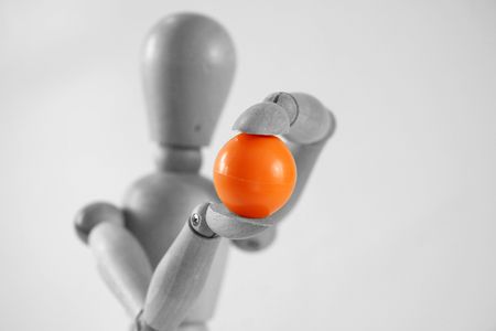 Woody Holding a Orange Ball, black and white with orange ballの写真素材