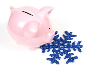 Piggy Bank with snowflake - Concept of heating cost the the Winter monthsの写真素材