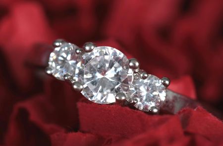 Engagement Ring taken closeup  on red backgroundの写真素材