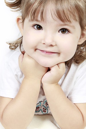 Adorable little girl isolated on white background の写真素材