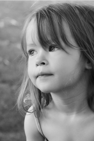 Adorable little girl taken closeup outdoors in summerの写真素材