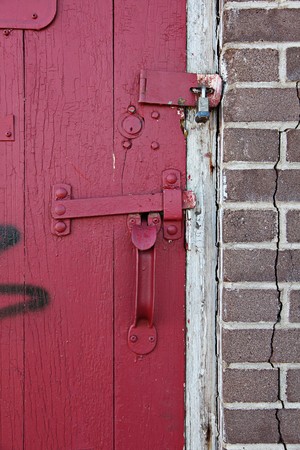 Old Red wooden door in old buildingの写真素材