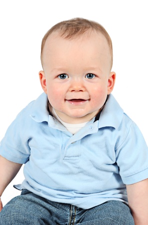 Cute baby boy posing for camera on white backgroundの写真素材