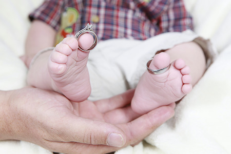 Cute little boy posing for camera on white backgroundの写真素材