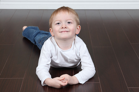 Cute little boy posing for camera on white backgroundの写真素材